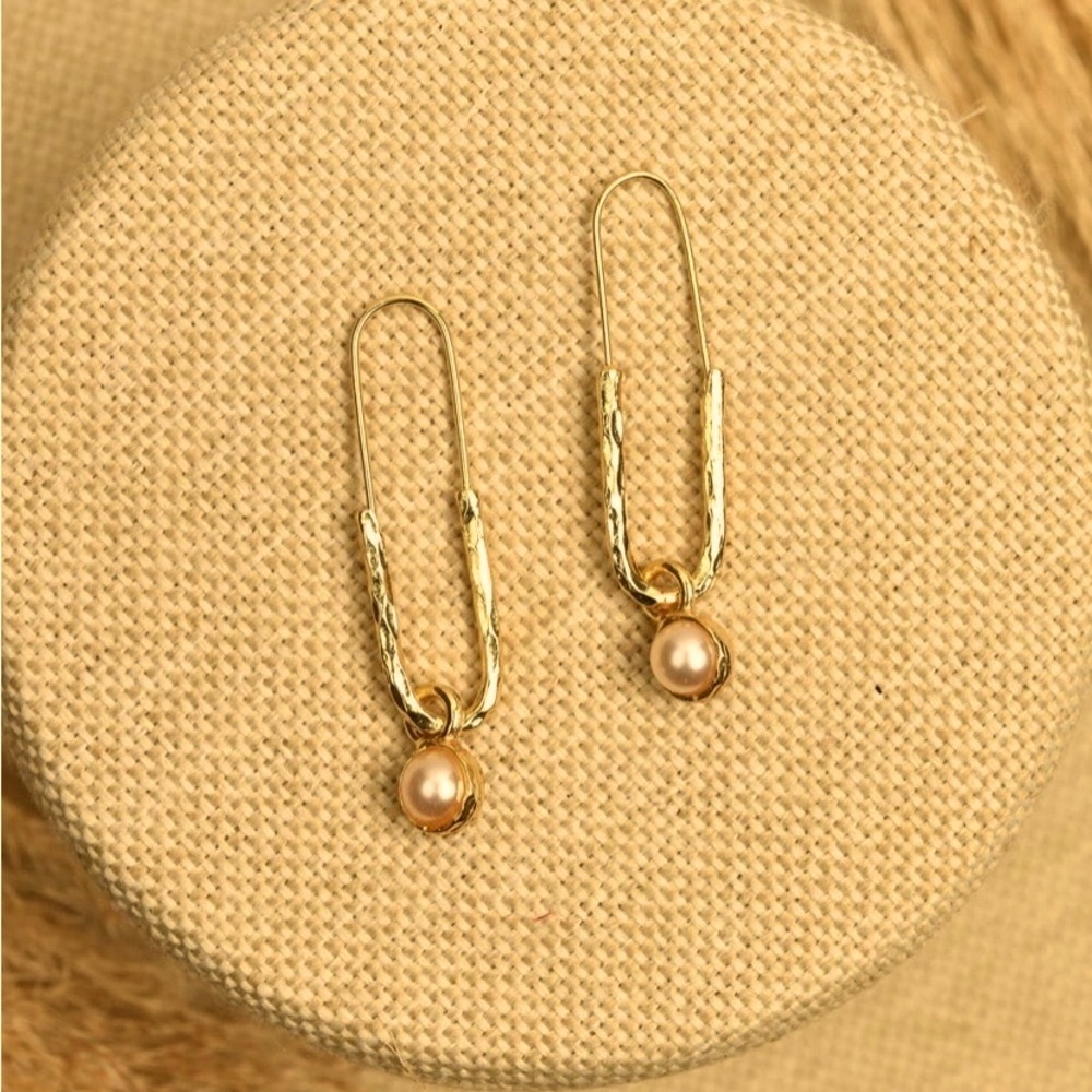 New Jimmy Key designed gold tone hoop earrings .
